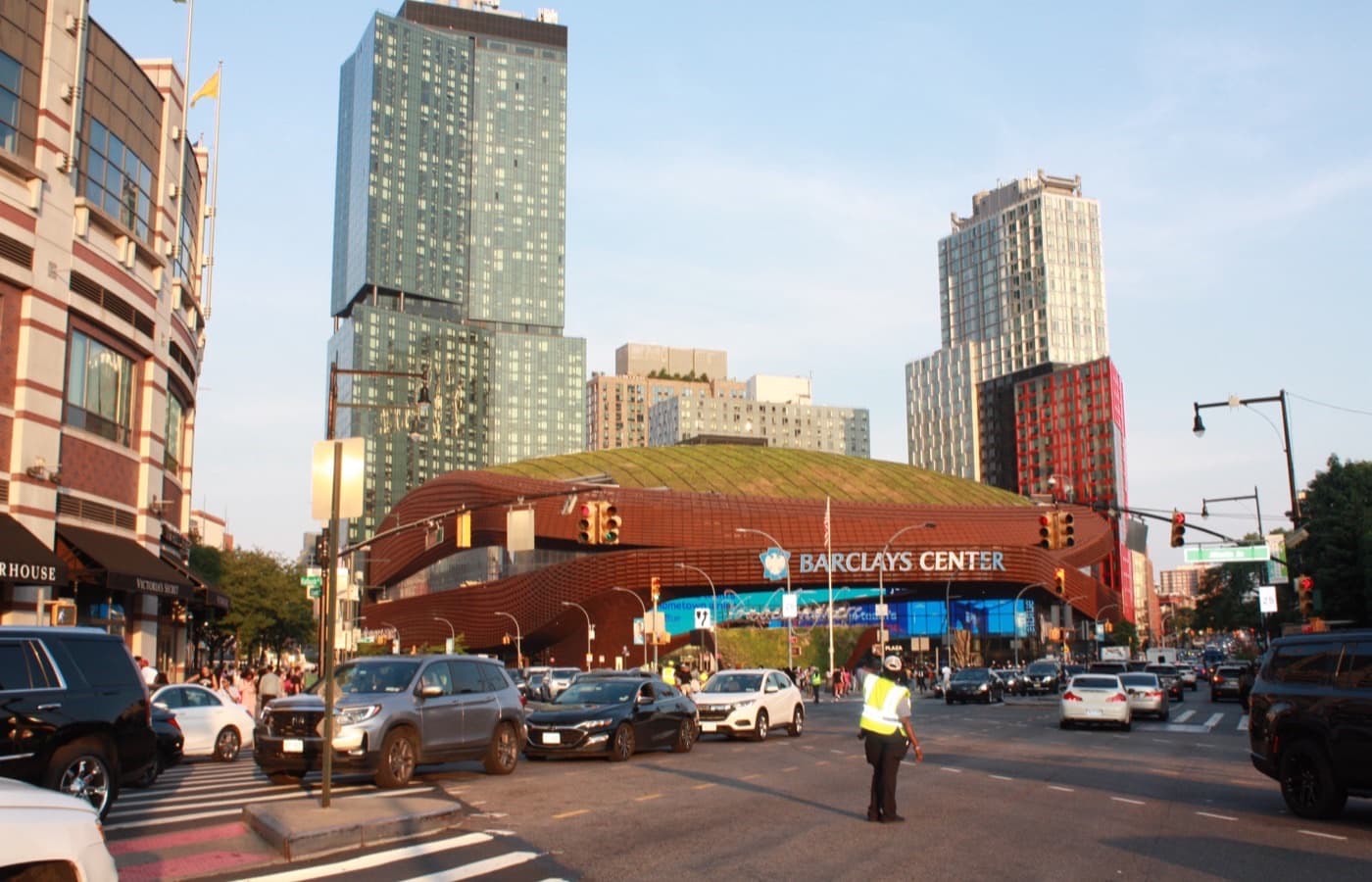 Barclays Center’s oculus entrance at Flatbush and Atlantic Avenues in Brooklyn, with the arena’s sign and the Prospect Heights towers behind it