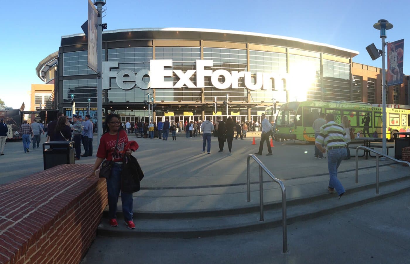 Fans on the plaza outside the glass-fronted FedExForum entrance in Memphis, under the arena’s large sign