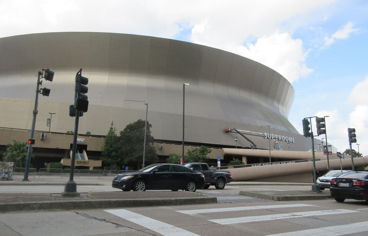 The Superdome’s curved exterior seen across Poydras Street in New Orleans