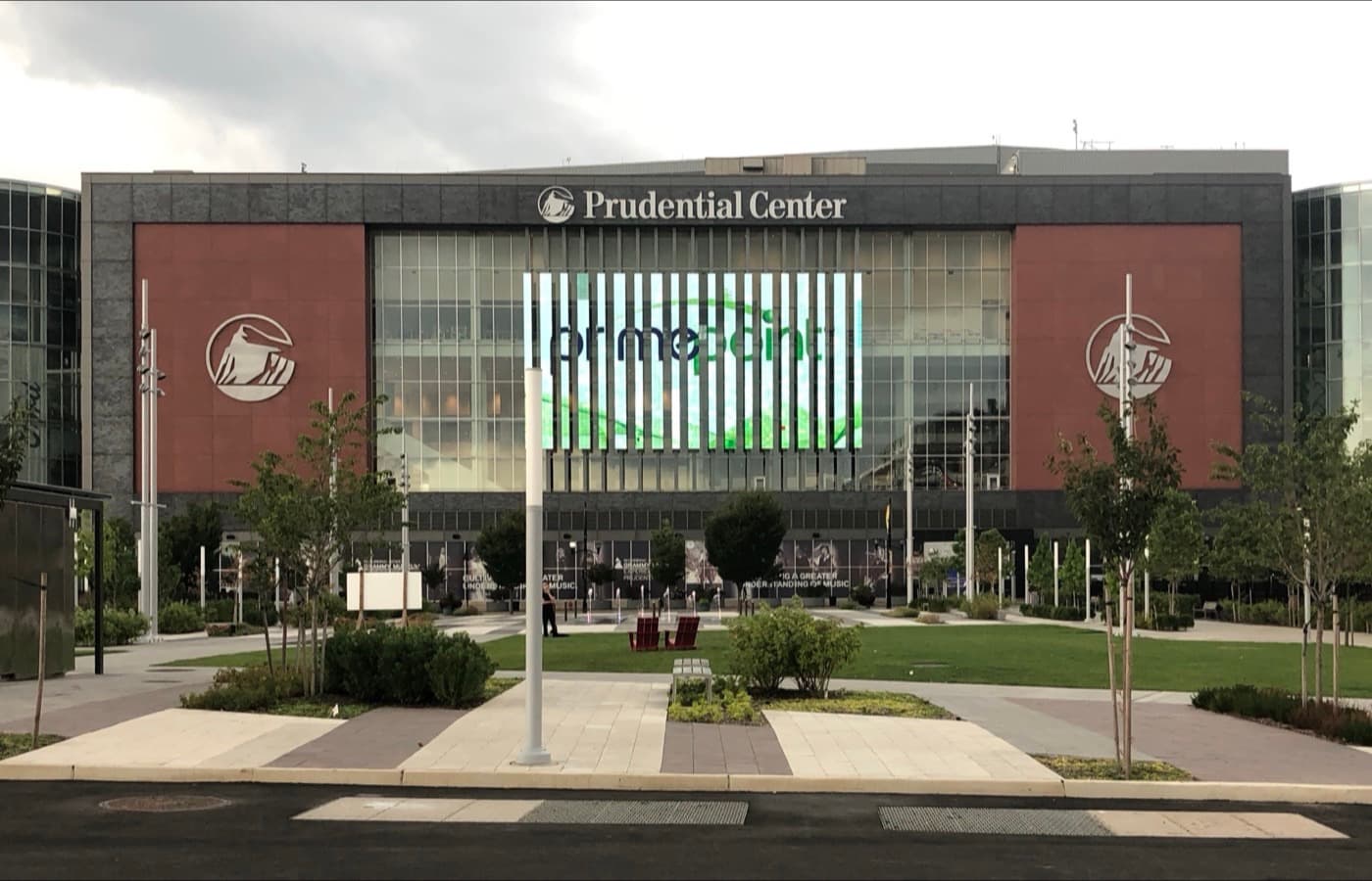 Exterior of Prudential Center in Newark, New Jersey, seen from Mulberry Commons park, with the arena’s signage and entrance plaza